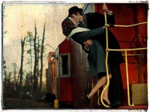 couple-kissing-on-a-train-400x300